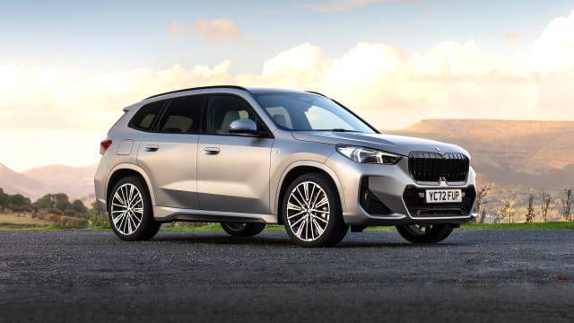 Silver BMW X1 parked in moorland setting